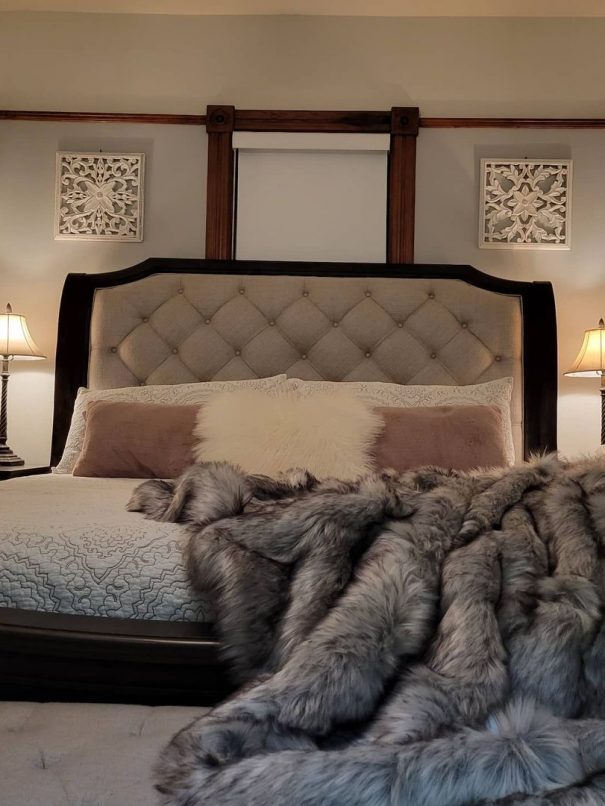 King bed dressed for winter comfort with faux fur