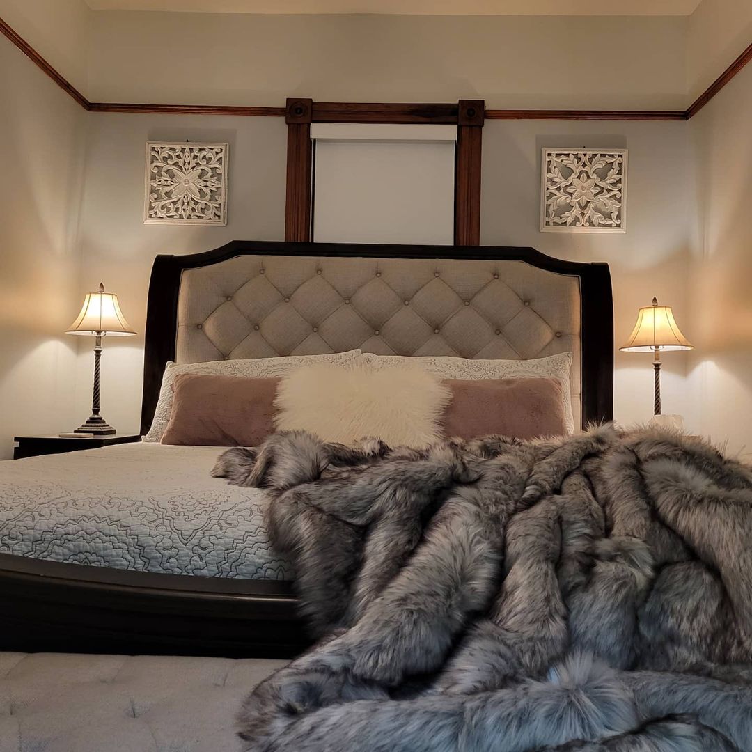 King bed dressed for winter comfort with faux fur