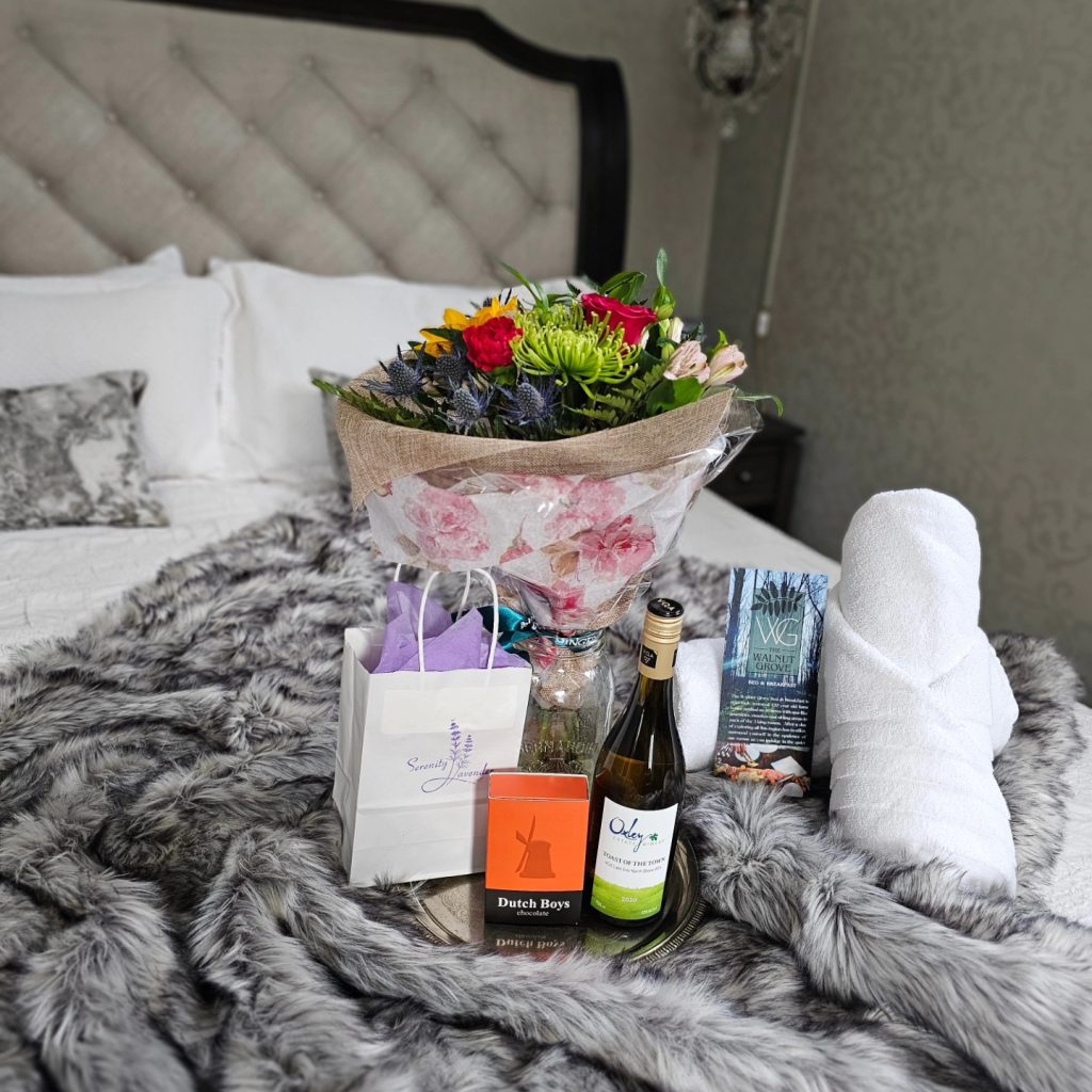An assortment of flowers, chocolate, wine and lavender products